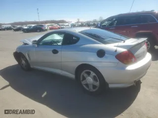 2003 Hyundai Tiburon GS with VIN KMHHM65D03U056017, listed as a Copart auction lot 49678695 with 99,729 mi miles and Salvage Title. Bid and sale history available at carsss.com. Image 2.