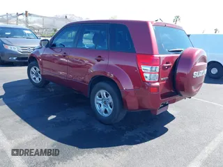 2008 Suzuki Grand Vitara w/Spare & Cargo Covers z VIN JS3TD941084101215, wystawiony jako IAAI lot #42154547 z przebiegiem 141 851 mil mil oraz . Historia ofert i sprzedaży dostępna na DreamBid. Obrazek 3.