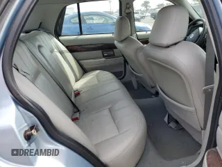 2005 Mercury Grand Marquis GS z VIN 2MEFM74W75X603444, wystawiony jako Copart lot #54395945 z przebiegiem 110 933 mil mil oraz Czysty tytuł • Clean title. Historia ofert i sprzedaży dostępna na DreamBid. Obrazek 10.