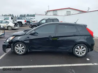 2012 Hyundai Accent SE with VIN KMHCU5AE1CU035390, listed as a IAAI auction lot 41765900 with 127,685 mi miles. Bid and sale history available at carsss.com. Image 14.