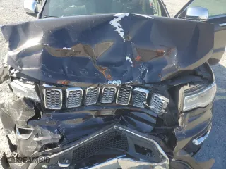 2017 Jeep Grand Cherokee Overland with VIN 1C4RJECG2HC712823, listed as a Copart auction lot 48063325 with 124,812 mi miles and Salvage Title. Bid and sale history available at carsss.com. Image 13.