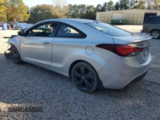 2014 Hyundai Elantra Coupe with VIN KMHDH6AH4EU026680, listed as a Copart auction lot 77350814 with 104,828 mi miles and Salvage Title. Bid and sale history available at carsss.com. Image 2.