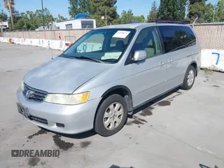 2002 Honda Odyssey EX z VIN 2HKRL186X2H513999, wystawiony jako IAAI lot #42348131 z przebiegiem 252 202 mil mil oraz . Historia ofert i sprzedaży dostępna na DreamBid. Obrazek 2.