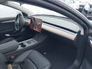 2023 Tesla Model 3 Long Range with VIN 5YJ3E1EB3PF389517, listed as a IAAI auction lot 41484978 with 13,411 mi miles and . Bid and sale history available at DreamBid. Image 5.