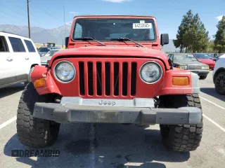 1999 Jeep Wrangler Sport with VIN 1J4FY19S7XP401120, listed as a Copart auction lot 64233665 with 129,708 mi miles and Salvage title. Bid and sale history available at DreamBid. Image 5.
