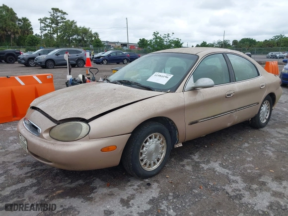 1996 Mercury Sable LS with VIN 1MELM53S6TA606332, listed as a IAAI auction lot 41984196 with 150,924 mi miles. Bid and sale history available at carsss.com. Image 2.