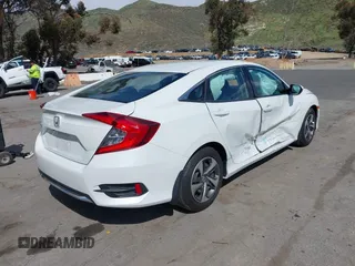 2020 Honda Civic Sedan LX with VIN 19XFC2F64LE201551, listed as a IAAI auction lot 41939055 with 67,461 mi miles. Bid and sale history available at carsss.com. Image 4.