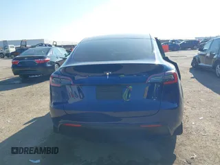 2021 Tesla Model Y Standard Range with VIN 5YJYGDED5MF121874, listed as a IAAI auction lot 41238170 with 72,041 mi miles and . Bid and sale history available at DreamBid. Image 16.