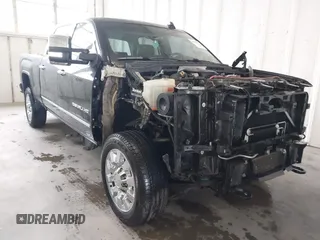 2016 GMC Sierra 2500HD Denali z VIN 1GT12UE82GF207890, wystawiony jako IAAI lot #41994971 z przebiegiem 101 221 mil mil oraz . Historia ofert i sprzedaży dostępna na DreamBid. Obrazek 1.