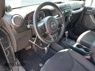 2014 Jeep Wrangler Sport with VIN 1C4AJWAG2EL113843, listed as a Copart auction lot 62771115 with 70,089 mi miles and Salvage title. Bid and sale history available at DreamBid. Image 8.