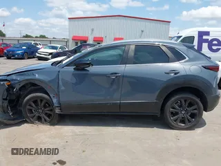 2022 Mazda CX-30 S Carbon Edition with VIN 3MVDMBCL6NM410330, listed as a IAAI auction lot 42107426 with 30,277 mi miles and . Bid and sale history available at DreamBid. Image 15.