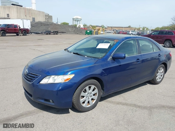 2007 Toyota Camry CE with VIN JTNBE46K373056707, listed as a IAAI auction lot 42128026 with 242,887 mi miles. Bid and sale history available at carsss.com. Image 2.