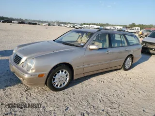 2000 Mercedes-Benz E-Class with VIN WDBJH65J4YB071699, listed as a Copart auction lot 75082144 with 105,989 mi miles and Salvage Title. Bid and sale history available at carsss.com. Image 1.