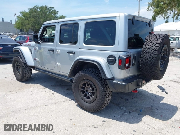 2023 Jeep Wrangler Rubicon with VIN 1C4JJXFG0PW522651, listed as a IAAI auction lot 42112210 with 7,744 mi miles and . Bid and sale history available at DreamBid. Image 3.