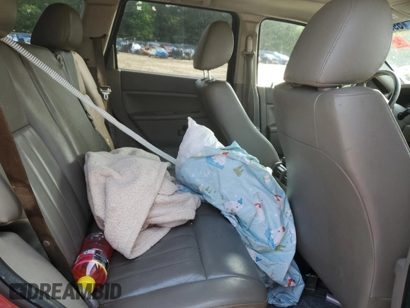 2005 Jeep Grand Cherokee Laredo с VIN 1J4HR48N85C558730, выставлен на аукционе Copart как лот 59030645 с пробегом 169 233 миль миль и Списание • Salvage title. История ставок и продаж доступна на DreamBid. Изображение 11.