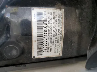 1997 Honda CR-V z VIN JHLRD1847VC006346, wystawiony jako Copart lot #57479845 z przebiegiem 248 721 mil mil oraz Szkoda całkowita • Salvage title. Historia ofert i sprzedaży dostępna na DreamBid. Obrazek 13.