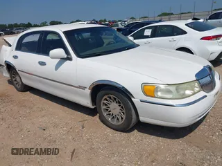 1998 Lincoln Town Car Signature with VIN 1LNFM82WXWY637398, listed as a IAAI auction lot 42658093 with 91,600 mi miles and . Bid and sale history available at DreamBid. Image 1.