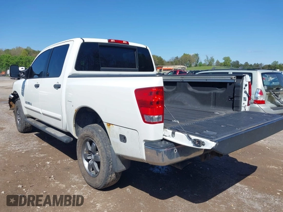 2014 Nissan Titan S with VIN 1N6AA0EC3EN502951, listed as a IAAI auction lot 41956309 with 128,464 mi miles and . Bid and sale history available at DreamBid. Image 3.