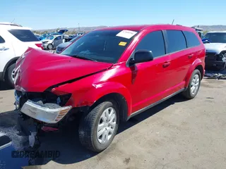 2015 Dodge Journey SE z VIN 3C4PDCAB9FT587668, wystawiony jako IAAI lot #41868556 z przebiegiem 99 695 mil mil oraz . Historia ofert i sprzedaży dostępna na DreamBid. Obrazek 2.