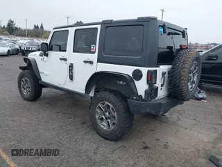 2014 Jeep Wrangler Unlimited Rubicon with VIN 1C4BJWFGXEL283929, listed as a IAAI auction lot 41812052 with 137,790 mi miles and . Bid and sale history available at DreamBid. Image 3.