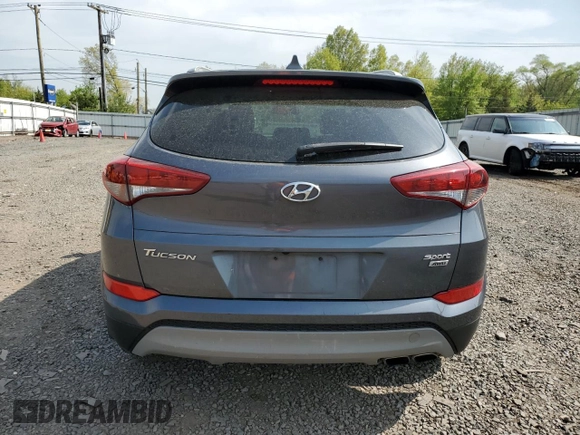 2018 Hyundai Tucson Sport z VIN KM8J3CAL4JU779009, wystawiony jako Copart lot #52777484 z przebiegiem 51 712 mil mil oraz Szkoda całkowita • Salvage title. Historia ofert i sprzedaży dostępna na DreamBid. Obrazek 6.