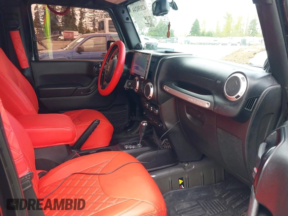 2014 Jeep Wrangler Unlimited Sahara with VIN 1C4BJWEG6EL107526, listed as a IAAI auction lot 42030244 with 69,077 mi miles. Bid and sale history available at carsss.com. Image 5.