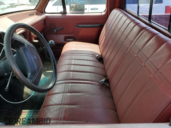 1987 Ford F-150 with VIN 1FTDF15Y9HNA25725, listed as a Copart auction lot 67257004 with 71,808 mi miles and Salvage Title. Bid and sale history available at carsss.com. Image 7.
