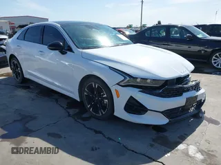 2023 Kia K5 GT-Line z VIN 5XXG64J2XPG178799, wystawiony jako IAAI lot #41710190 z przebiegiem 27 438 mil mil oraz . Historia ofert i sprzedaży dostępna na DreamBid. Obrazek 1.