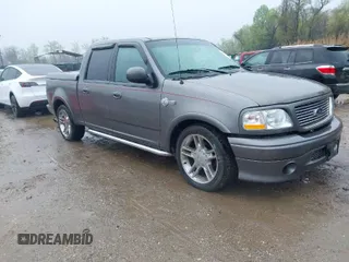 2002 Ford F-150 Harley Davidson with VIN 1FTRW07392KD29874, listed as a IAAI auction lot 41974230 with 163,279 mi miles. Bid and sale history available at carsss.com. Image 1.
