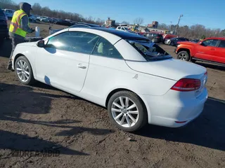 2015 Volkswagen Eos Komfort with VIN WVWBW8AH0FV001011, listed as a IAAI auction lot 41297299 with 81,444 mi miles and . Bid and sale history available at DreamBid. Image 3.