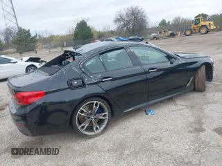 2018 BMW 5 Series M550i xDrive with VIN WBAJB9C56JB286742, listed as a IAAI auction lot 42176643 with 61,445 mi miles and . Bid and sale history available at DreamBid. Image 4.