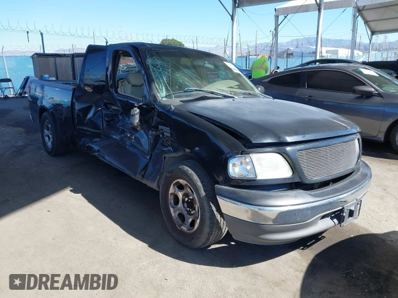 2002 Ford F-150 XL with VIN 1FTRX17WX2NB99454, listed as a IAAI auction lot 41643850 with 180,149 mi miles. Bid and sale history available at carsss.com. Image 1.