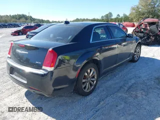 2015 Chrysler 300 Limited with VIN 2C3CCARG9FH838420, listed as a IAAI auction lot 41684228 with 242,316 mi miles. Bid and sale history available at carsss.com. Image 4.