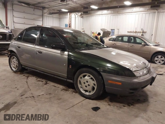 1997 Saturn SL with VIN 1G8ZH5280VZ172929, listed as a IAAI auction lot 41273214 with 134,972 mi miles. Bid and sale history available at carsss.com. Image 1.