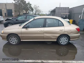 2002 Kia Rio with VIN KNADC123626192611, listed as a IAAI auction lot 41765104 with 62,387 mi miles. Bid and sale history available at carsss.com. Image 14.