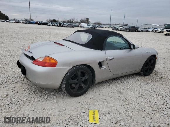 2001 Porsche Boxster с VIN WP0CA29821U621779, выставлен на аукционе Copart как лот 87204984 с пробегом 82 091 миль миль и Списание • Salvage title. История ставок и продаж доступна на DreamBid. Изображение 3.