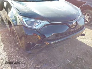 2018 Toyota RAV4 LE with VIN 2T3BFREV8JW706999, listed as a IAAI auction lot 41863485 with 115,589 mi miles. Bid and sale history available at carsss.com. Image 6.