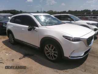 2017 Mazda CX-9 Signature with VIN JM3TCBEY2H0140598, listed as a IAAI auction lot 42561999 with 61,574 mi miles and . Bid and sale history available at DreamBid. Image 1.
