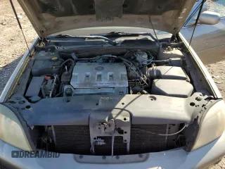 2001 Cadillac DeVille DHS z VIN 1G6KE57Y21U250470, wystawiony jako Copart lot #57334785 z przebiegiem 66 703 mil mil oraz Tytuł czysty. Historia ofert i sprzedaży dostępna na DreamBid. Obrazek 11.