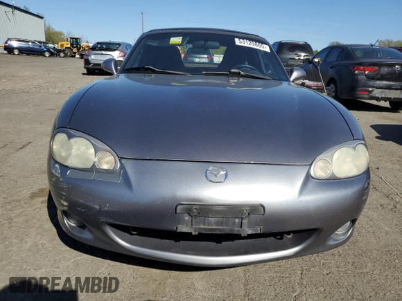 2003 Mazda MX-5 Miata Cloth with VIN JM1NB353430308653, listed as a Copart auction lot 53129865 with 144,549 mi miles and Salvage Title. Bid and sale history available at DreamBid. Image 5.