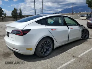 2022 Tesla Model 3 Long Range with VIN 5YJ3E1EB4NF139023, listed as a Copart auction lot 51410345 with 54,789 mi miles and Salvage Title. Bid and sale history available at DreamBid. Image 3.