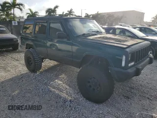 1998 Jeep Cherokee Country with VIN 1J4FT78S8XL520854, listed as a Copart auction lot 79304214 with 111,674 mi miles and Clean title. Bid and sale history available at DreamBid. Image 4.