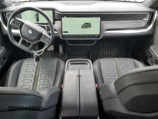 2022 Rivian R1S Launch Edition with VIN 7PDSGABL3NN000739, listed as a Copart auction lot 88127995 with 12,143 mi miles and Salvage Title. Bid and sale history available at DreamBid. Image 8.