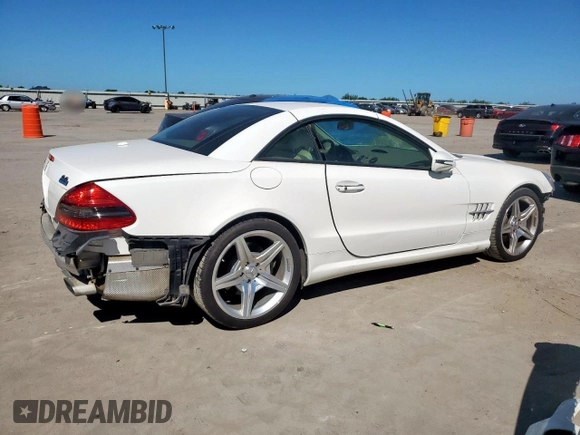 2009 Mercedes-Benz SL 550 with VIN WDBSK71F69F147589, listed as a Copart auction lot 65976995 with 77,387 mi miles and Salvage title. Bid and sale history available at DreamBid. Image 3.