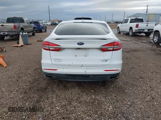2019 Ford Fusion Titanium with VIN 3FA6P0D93KR138574, listed as a IAAI auction lot 41967094 with 118,297 mi miles. Bid and sale history available at carsss.com. Image 16.