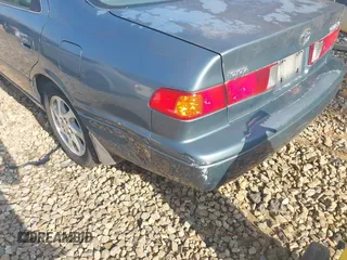 2000 Toyota Camry CE z VIN JT2BG22K5Y0476098, wystawiony jako IAAI lot #42200385 z przebiegiem Nie podano mil oraz . Historia ofert i sprzedaży dostępna na DreamBid. Obrazek 14.