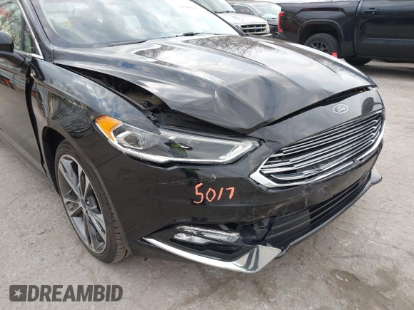2017 Ford Fusion Titanium z VIN 3FA6P0K98HR200272, wystawiony jako IAAI lot #41905017 z przebiegiem 104 132 mil mil oraz . Historia ofert i sprzedaży dostępna na DreamBid. Obrazek 6.