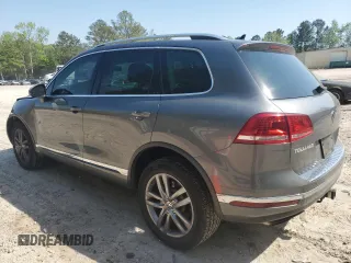 2016 Volkswagen Touareg Sport с VIN WVGEF9BP1GD012594, выставлен на аукционе Copart как лот 52438305 с пробегом 125 204 миль миль и Списание • Salvage title. История ставок и продаж доступна на DreamBid. Изображение 2.