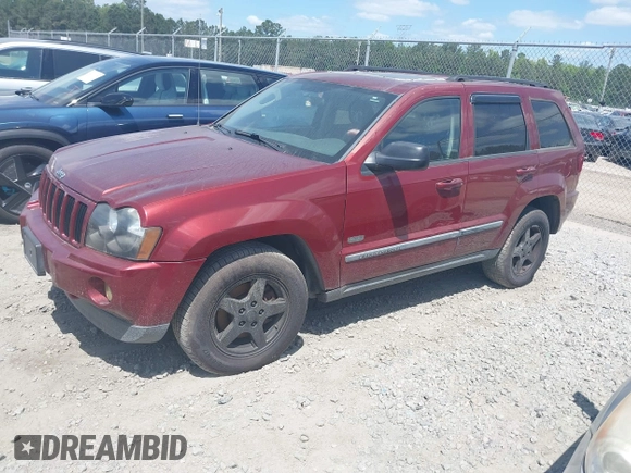 2007 Jeep Grand Cherokee Laredo with VIN 1J8GR48K57C618529, listed as a IAAI auction lot 42139566 with 174,559 mi miles. Bid and sale history available at carsss.com. Image 2.