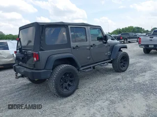 2018 Jeep Wrangler Unlimited Sport with VIN 1C4BJWDG4JL814233, listed as a IAAI auction lot 42112347 with 104,113 mi miles and . Bid and sale history available at DreamBid. Image 4.